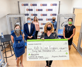 Lee Marshall receives check from Regions